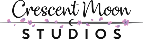 A 500px dark version of Crescent Moon Studio's logo. Crescent Moon is in a hand-written font while Studios appears typed. There is a grey line separating Crescent Moon on top and Studios on the bottom with pink and purple petals scattered over the line.